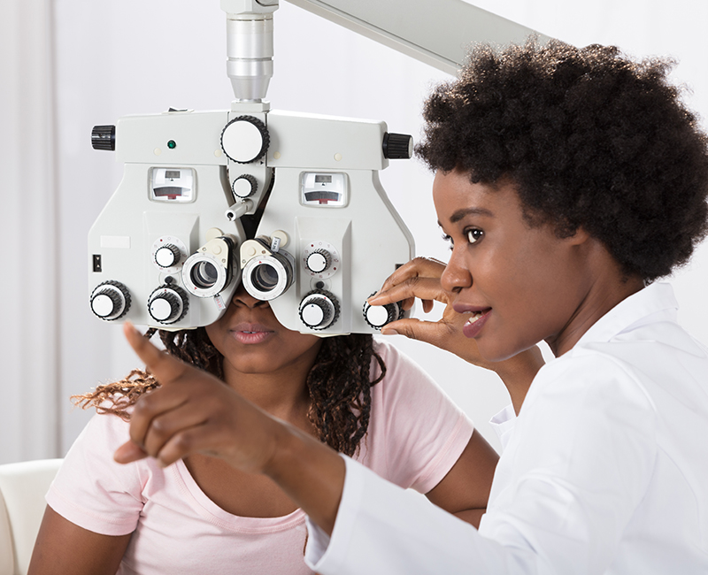 Optometrist Doing Sight Testing For Patient 