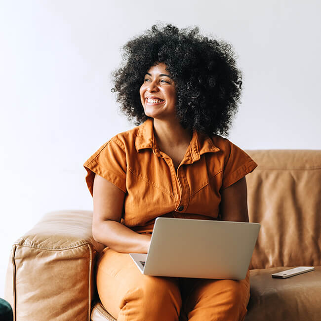 Businesswoman smiling happily while sitting in an office